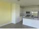 Bright kitchen with white cabinets, stainless steel appliances, and a gray countertop at 3069 Caribbean Soul Dr, Kissimmee, FL 34747