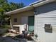 Exterior rear view displaying the backyard and adjacent features of the house at 6971 Pompeii Rd, Orlando, FL 32822