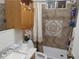 Bathroom featuring a single sink vanity, toilet, and shower at 6971 Pompeii Rd, Orlando, FL 32822