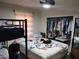 Bedroom featuring a bed, closet, and window at 6971 Pompeii Rd, Orlando, FL 32822