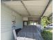 Exterior view of the home, showcasing a covered area and window at 6971 Pompeii Rd, Orlando, FL 32822