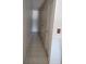 Hallway featuring tiled floor and a door on the right at 6971 Pompeii Rd, Orlando, FL 32822