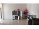 Neutral living area provides natural light and tile floors at 6971 Pompeii Rd, Orlando, FL 32822
