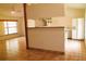 Open living space connecting the kitchen with tile flooring and natural light at 10411 County Road 474, Clermont, FL 34714