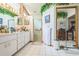 Bathroom featuring tile flooring, walk-in shower, vanity, and mirrored sliding door closet at 418 W Holly Dr, Orange City, FL 32763
