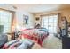 Bedroom featuring carpeted floors, a large window, and neutral walls at 418 W Holly Dr, Orange City, FL 32763