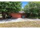 Detached red brick garage and driveway at 418 W Holly Dr, Orange City, FL 32763