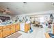 Open kitchen featuring tiled floors and traditional wood cabinets at 418 W Holly Dr, Orange City, FL 32763