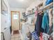 Functional laundry room with shelving, a utility sink, a washer, and a dryer at 418 W Holly Dr, Orange City, FL 32763
