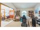 Living area with an eclectic collection of furniture and decor, including arched window at 418 W Holly Dr, Orange City, FL 32763