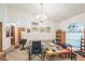 Cozy living area featuring a chandelier, and multiple doorways at 418 W Holly Dr, Orange City, FL 32763