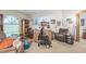 Spacious living room with an eclectic collection of furniture and decor at 418 W Holly Dr, Orange City, FL 32763