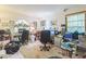 Dedicated home office space with desks, chairs, and natural light from the window at 418 W Holly Dr, Orange City, FL 32763