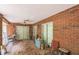 Covered patio with brick siding and sliding glass doors at 418 W Holly Dr, Orange City, FL 32763