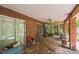 Covered patio with brick siding and ceiling fan at 418 W Holly Dr, Orange City, FL 32763