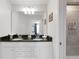 Bathroom with double sink vanity, granite countertop, and walk-in shower at 5545 Misty Oak Cir, Davenport, FL 33837