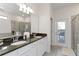 Stylish bathroom with double sinks, granite counters, and a separate tub and shower at 5545 Misty Oak Cir, Davenport, FL 33837