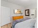 Bright bedroom showcases the furnishings, closet, and mounted TV at 5545 Misty Oak Cir, Davenport, FL 33837