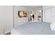 This bedroom features a comfortable bed, a TV, ensuite bathroom access, and a bright color palette at 5545 Misty Oak Cir, Davenport, FL 33837