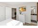This bedroom features a comfortable bed, a TV, ensuite bathroom access, and a bright color palette at 5545 Misty Oak Cir, Davenport, FL 33837