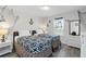 Coastal-themed bedroom featuring two beds, nautical decor, and a window with natural light at 5545 Misty Oak Cir, Davenport, FL 33837