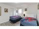 A bedroom with two twin beds, themed decor, and natural light at 5545 Misty Oak Cir, Davenport, FL 33837