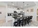 Modern kitchen featuring an island with seating, stainless appliances, and bright lighting is ideal for cooking at 5545 Misty Oak Cir, Davenport, FL 33837
