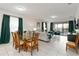 Inviting living area with elegant dining space and outdoor access perfect for entertaining or relaxing at 5545 Misty Oak Cir, Davenport, FL 33837