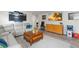 Comfortable living room with a sectional sofa, decorative coffee table, and entertainment center at 5545 Misty Oak Cir, Davenport, FL 33837