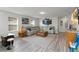 Bright living room features a sectional sofa, modern decor, and plenty of natural light at 5545 Misty Oak Cir, Davenport, FL 33837
