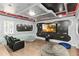 Unique media room with a large screen, comfortable seating, and a futuristic design for immersive entertainment at 5545 Misty Oak Cir, Davenport, FL 33837