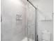 Modern walk-in shower with glass door and tiled walls at 5545 Misty Oak Cir, Davenport, FL 33837