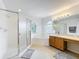 Bright bathroom featuring a shower, a tub, and a single sink vanity with plenty of lighting at 9525 Southern Garden Cir, Altamonte Springs, FL 32714
