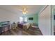 Charming bedroom with light-colored walls, wood floor, ceiling fan, and window providing natural light at 9525 Southern Garden Cir, Altamonte Springs, FL 32714
