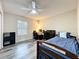 Comfortable bedroom featuring neutral walls, laminate flooring and a ceiling fan at 9525 Southern Garden Cir, Altamonte Springs, FL 32714