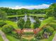 A brick sign at the Camden Club entrance is surrounded by landscaping and a pond with a fountain at 9525 Southern Garden Cir, Altamonte Springs, FL 32714