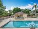 Wonderful community pool area with a covered seating area, lounge chairs, and a meticulously maintained pool at 9525 Southern Garden Cir, Altamonte Springs, FL 32714