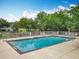 Inviting community pool area with lounge chairs and a playground, perfect for relaxation and Gathering fun at 9525 Southern Garden Cir, Altamonte Springs, FL 32714