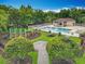 Aerial view of a community pool area with a playground, cabana and lounge chairs for ultimate relaxation at 9525 Southern Garden Cir, Altamonte Springs, FL 32714