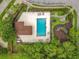 Aerial view of a beautiful community pool with a recreation area and playground for outdoor fun and relaxation at 9525 Southern Garden Cir, Altamonte Springs, FL 32714