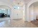Bright foyer with tile floors leading to an office with neutral paint, with an arched entryway at 9525 Southern Garden Cir, Altamonte Springs, FL 32714