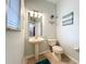 Charming half bathroom featuring pedestal sink, decorative mirror and tile flooring at 9525 Southern Garden Cir, Altamonte Springs, FL 32714