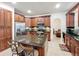 Spacious kitchen with an island, stainless steel appliances, and dark wood cabinetry at 9525 Southern Garden Cir, Altamonte Springs, FL 32714