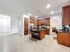 A large kitchen with a center island offers plenty of space for cooking and entertaining at 9525 Southern Garden Cir, Altamonte Springs, FL 32714
