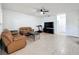 Living room with leather sofas, a ceiling fan, and a mounted TV at 9525 Southern Garden Cir, Altamonte Springs, FL 32714