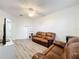 Inviting living room space with neutral tones and laminate flooring, perfect for entertaining at 9525 Southern Garden Cir, Altamonte Springs, FL 32714