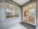 Covered patio showcasing sliding glass doors leading to a dining area and a view of the backyard at 9525 Southern Garden Cir, Altamonte Springs, FL 32714