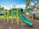 Community playground with a slide and climbing structure for enjoyment at 9525 Southern Garden Cir, Altamonte Springs, FL 32714
