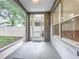 View of the covered porch and fenced backyard, offering a tranquil and private outdoor space at 9525 Southern Garden Cir, Altamonte Springs, FL 32714