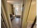 Bright bathroom with tub-shower combination and vanity with storage at 2094 Penn Dr, Deland, FL 32724